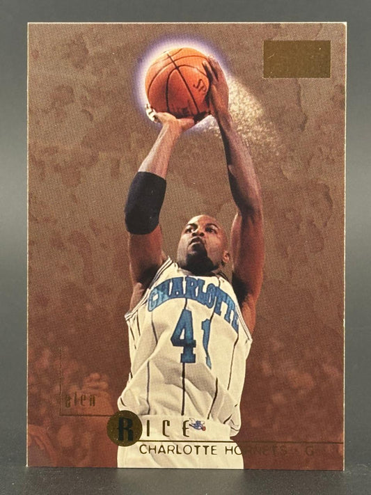 Glen Rice basketball card, Charlotte Hornets, holding basketball above head, sepia-toned background.
