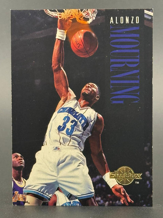 Alonzo Mourning SkyBox basketball card featuring him dunking in a Charlotte Hornets uniform.