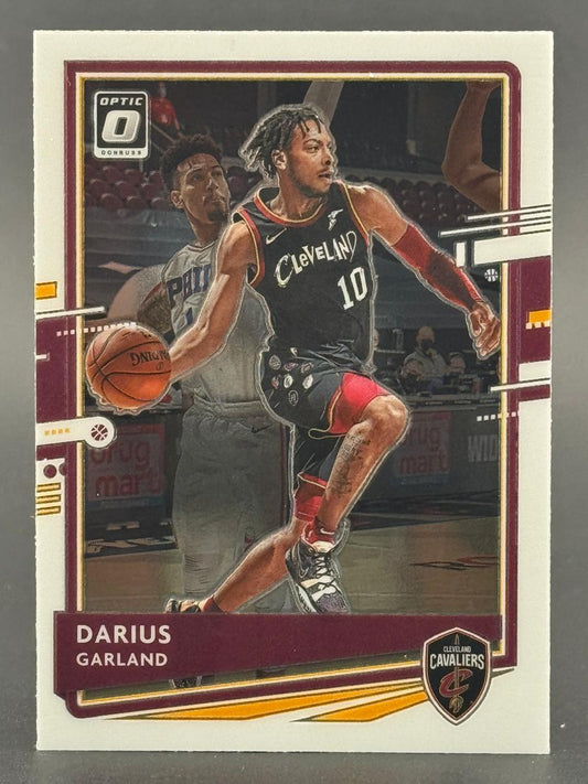 Trading card of Darius Garland dribbling, featuring the Optic Donruss logo and Cleveland Cavaliers branding.
