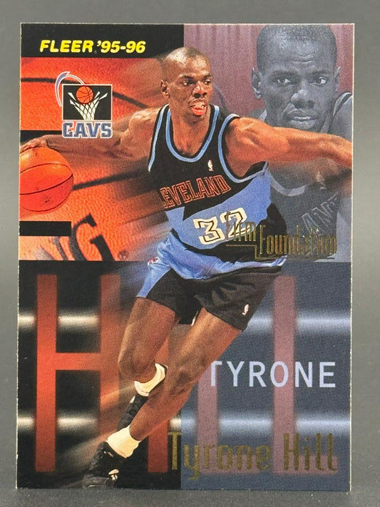 1995-96 Fleer Tyrone Hill basketball card #32, showing Hill in a Cavaliers uniform.