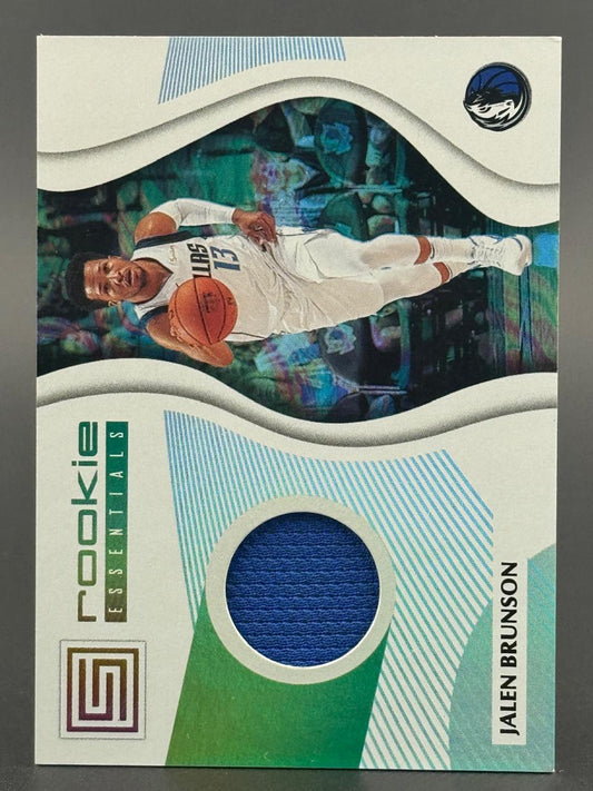 2018-19 Panini Status Jalen Brunson Rookie Essentials trading card with a blue jersey relic.