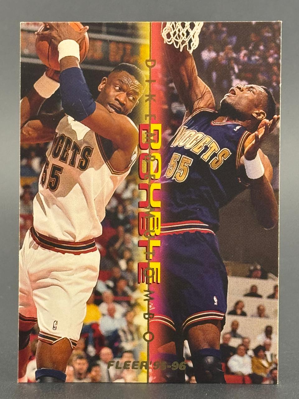1995-96 Fleer Dikembe Mutombo basketball trading card featuring two images of Mutombo in Nuggets uniform.