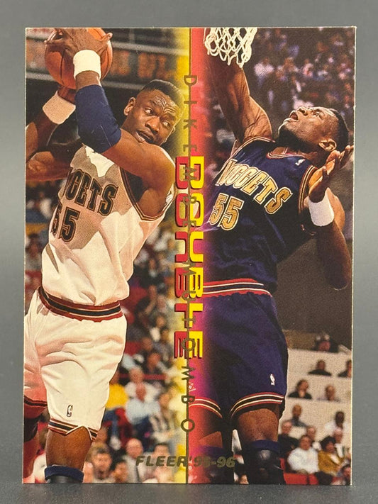 1995-96 Fleer Dikembe Mutombo basketball trading card featuring two images of Mutombo in Nuggets uniform.