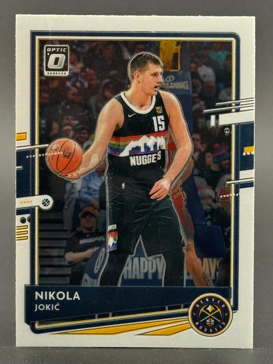 Nikola Jokić Donruss Optic basketball trading card holding a basketball.