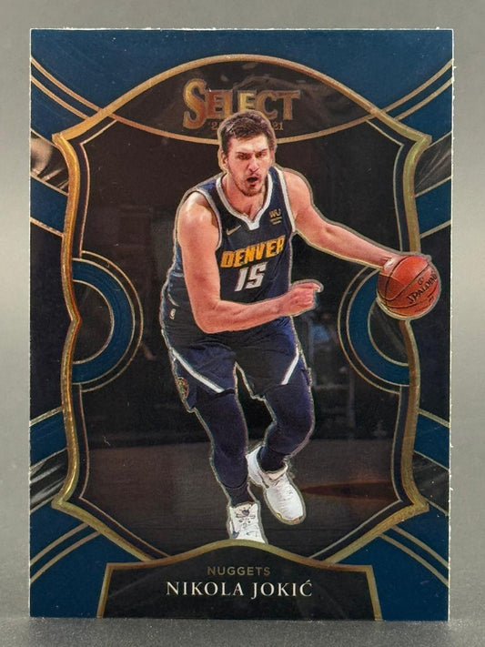 2020-21 Panini Select Nikola Jokić basketball card #15, featuring Jokić dribbling in a Nuggets uniform.
