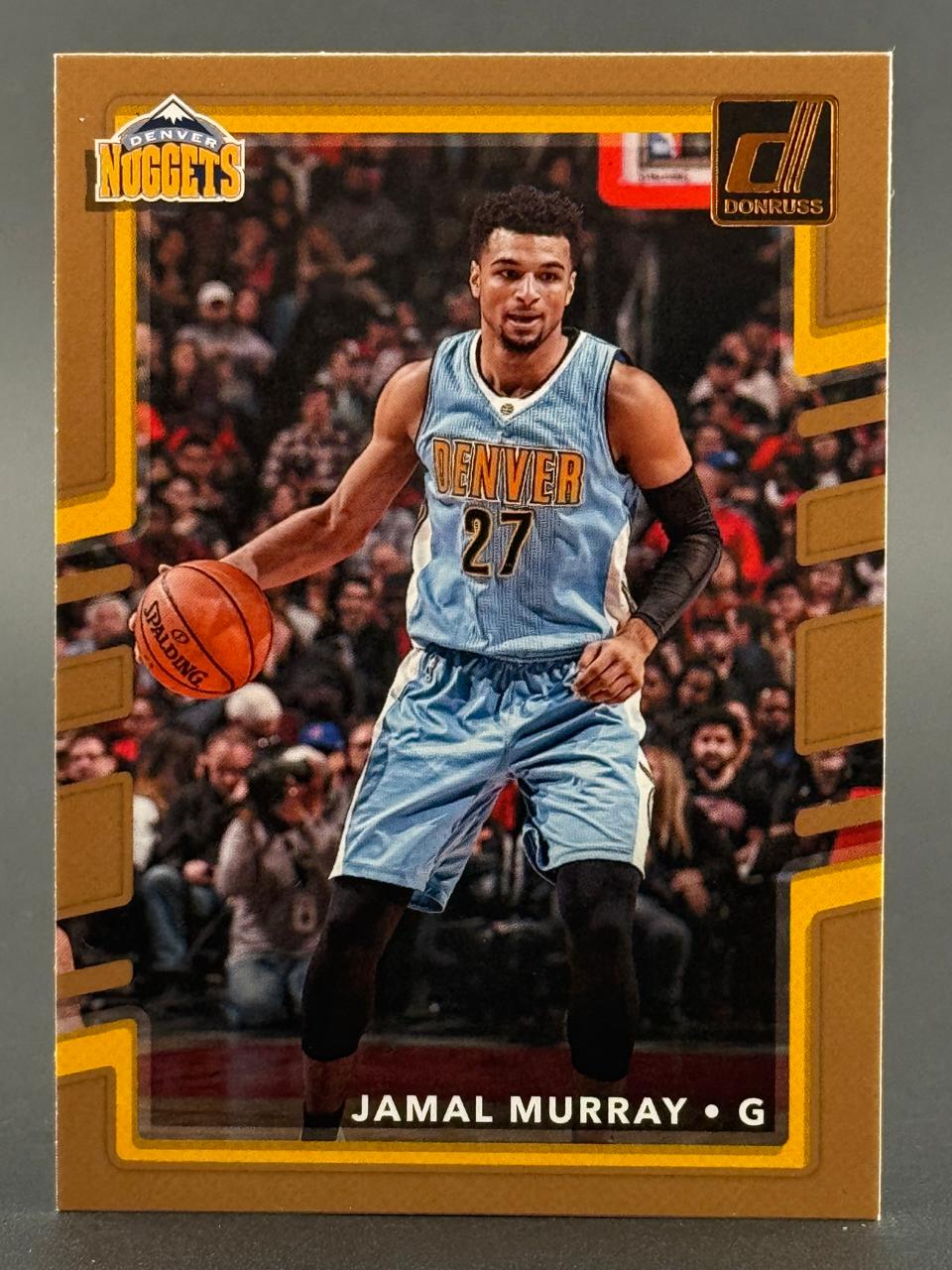Jamal Murray Donruss basketball card featuring him dribbling in a Denver Nuggets uniform.