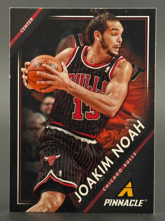 2015-16 Pinnacle Joakim Noah basketball card holding a basketball in a Bulls pinstripe uniform.