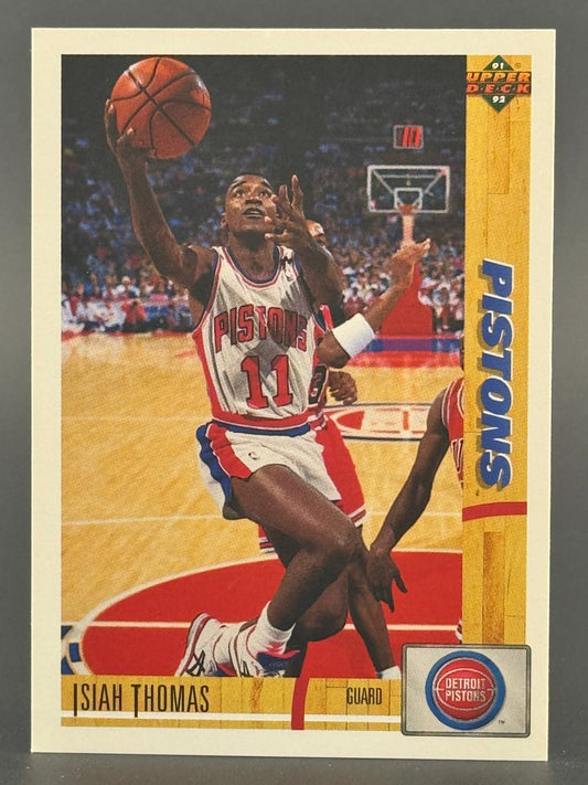 1991-92 Upper Deck Isiah Thomas #84 basketball card, featuring Thomas in a Detroit Pistons uniform driving the lane.
