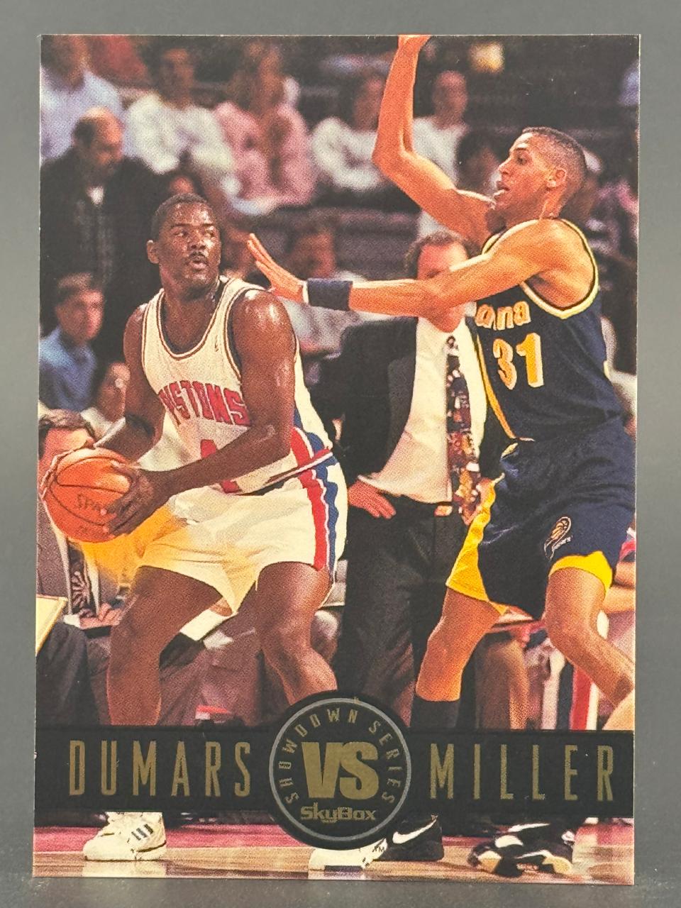 Joe Dumars and Reggie Miller on a 1990s SkyBox basketball trading card.