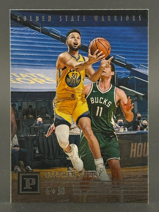 Stephen Curry 2021-22 Panini basketball card, #6-30, showing him driving against a Milwaukee Bucks defender.
