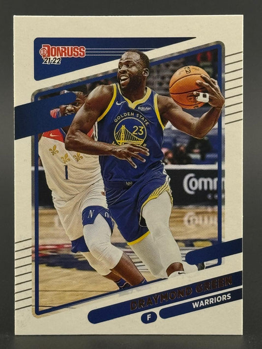 2021-22 Donruss Draymond Green trading card featuring him dribbling in a Warriors uniform.