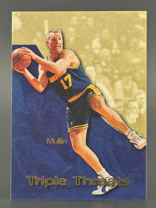 Chris Mullin basketball card, "Triple Threats" set, featuring Mullin holding a basketball in a blue and yellow jersey.