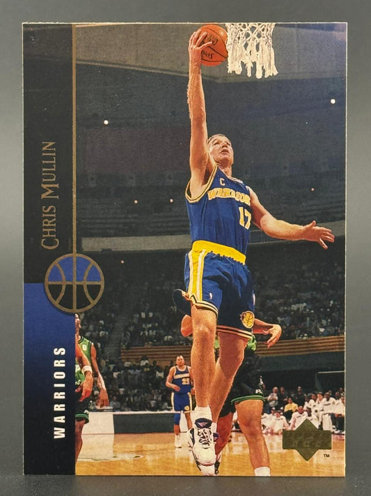 Trading card of Chris Mullin in a Warriors uniform dunking a basketball.