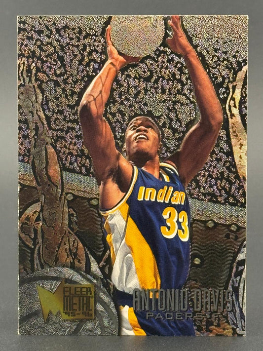 1995-96 Fleer Metal Antonio Davis trading card featuring Davis in a Pacers uniform shooting.