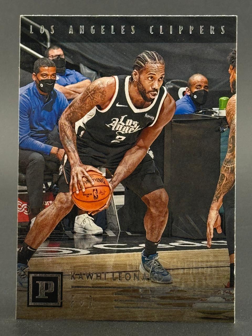 Kawhi Leonard basketball card, Los Angeles Clippers, dribbling a basketball on court.