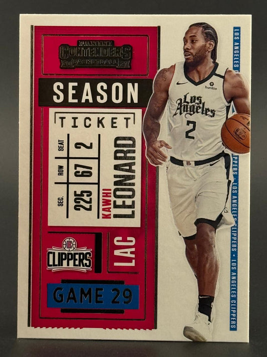 2020-21 Panini Contenders Kawhi Leonard trading card featuring player in uniform dribbling a basketball.
