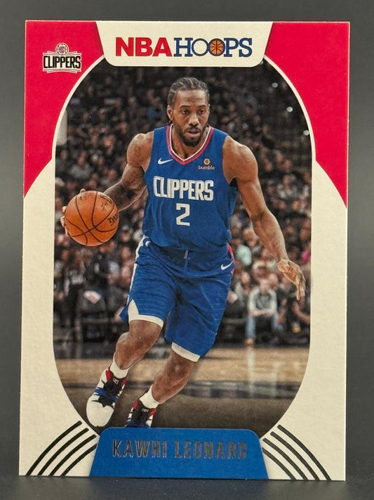 Kawhi Leonard 2019-20 NBA Hoops trading card dribbling in a blue Clippers uniform.