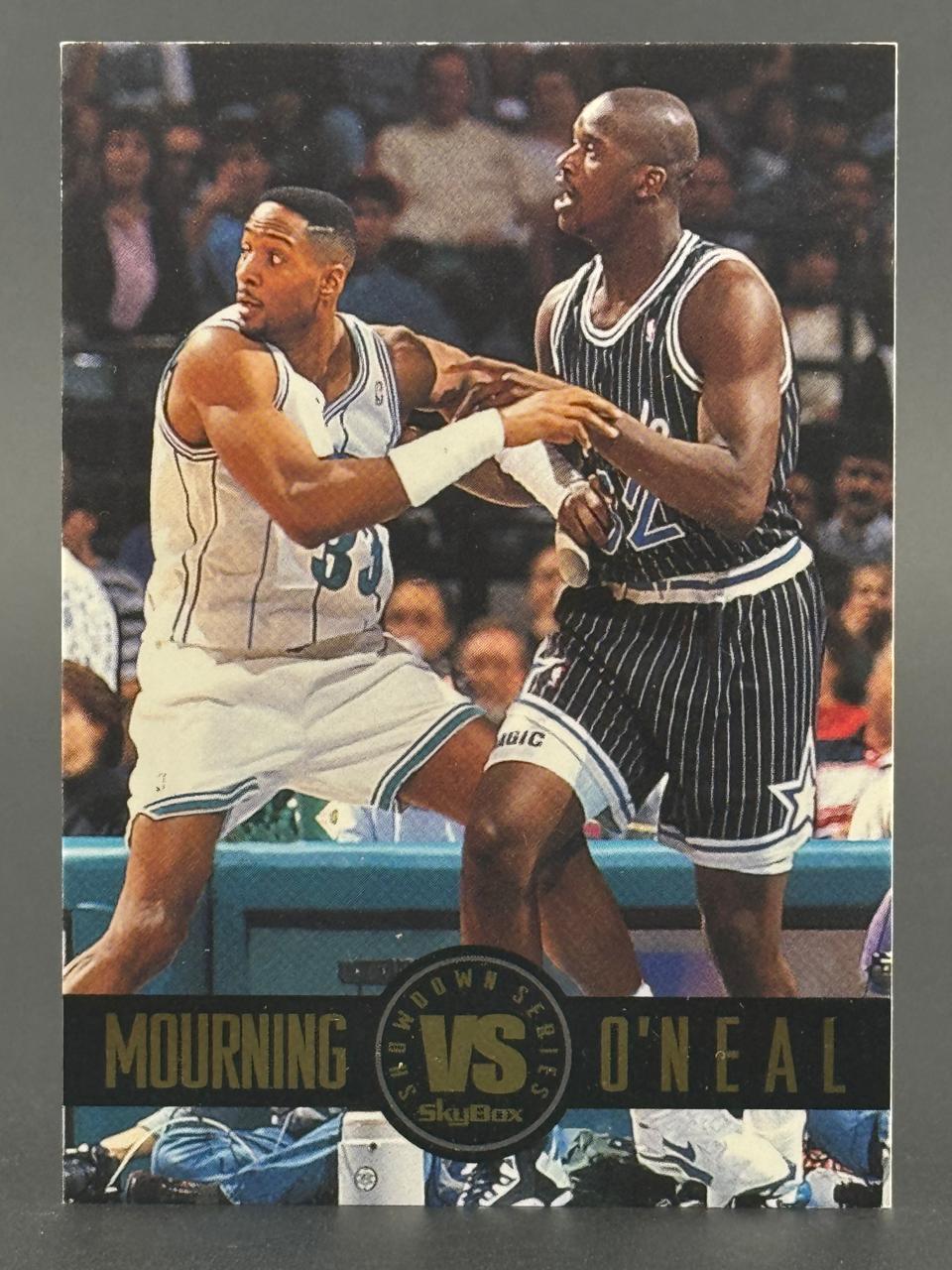 Alonzo Mourning and Shaquille O'Neal on a 1993-94 SkyBox Showdown Series trading card.