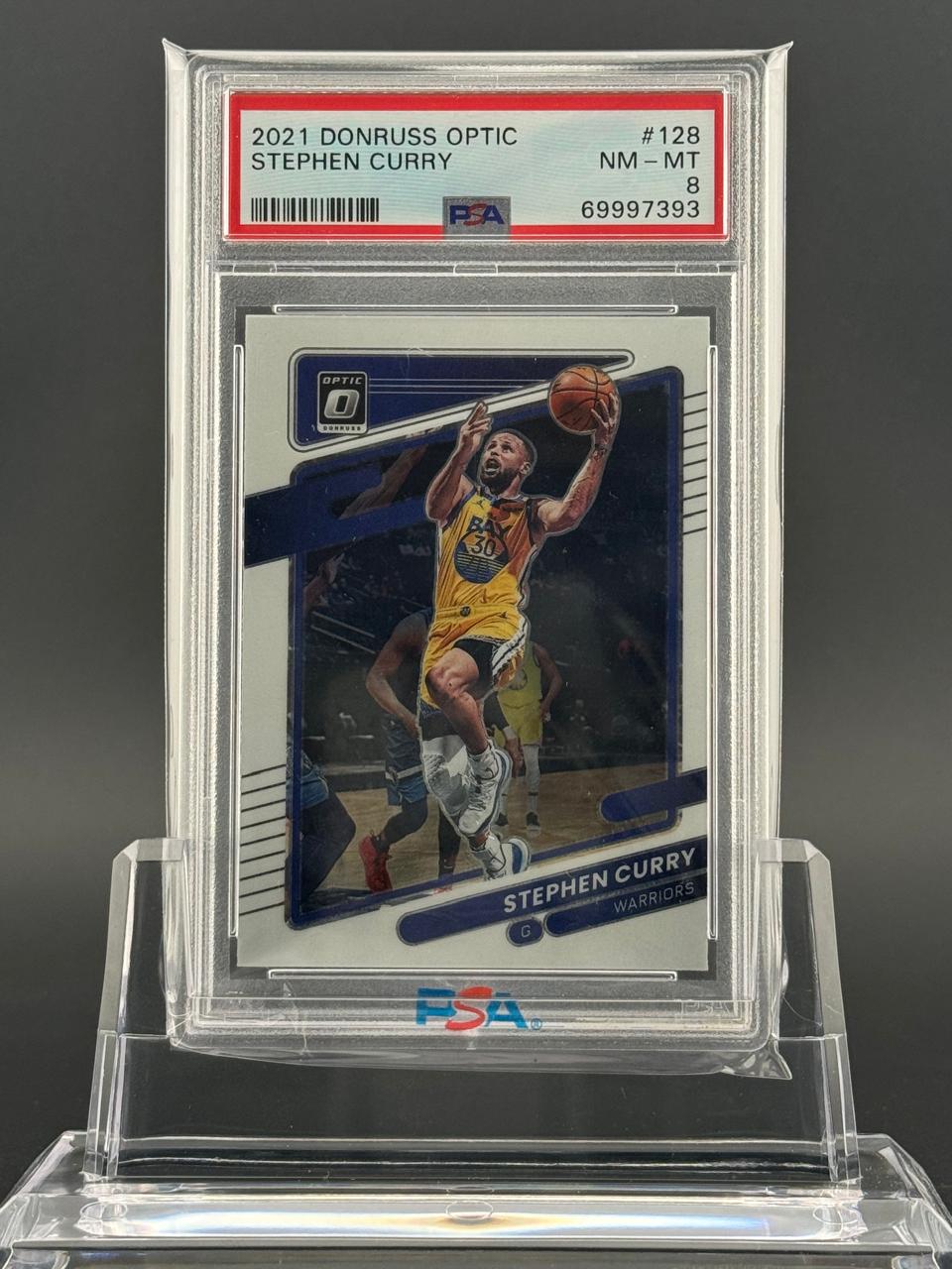 PSA 8 graded 2021 Donruss Optic Stephen Curry trading card #128.