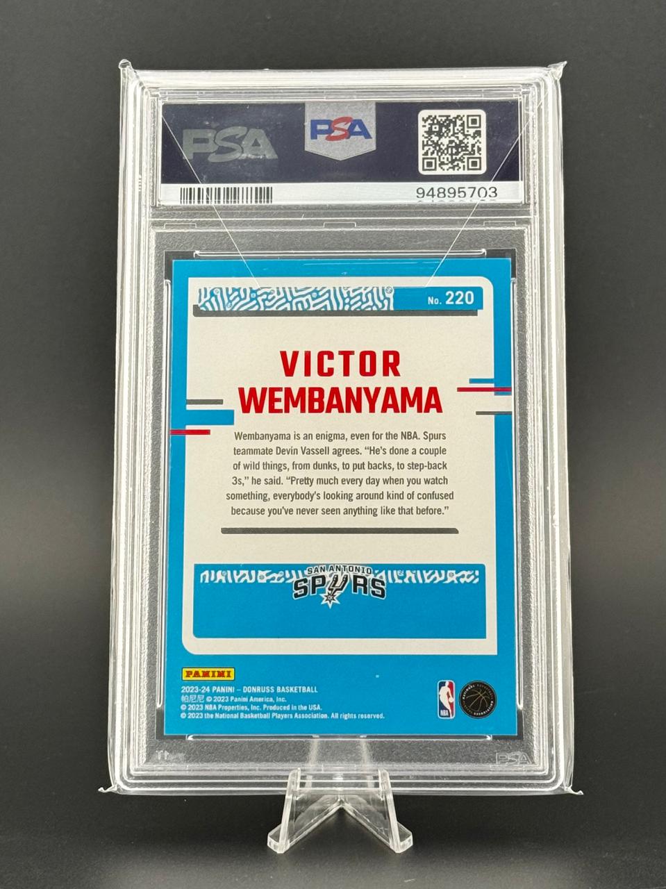 PSA-graded 2023-24 Panini Donruss Victor Wembanyama basketball card #220, back view.