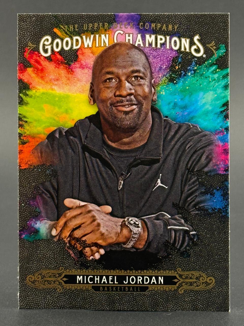 Michael Jordan Upper Deck Goodwin Champions basketball trading card with a colorful splattered background.