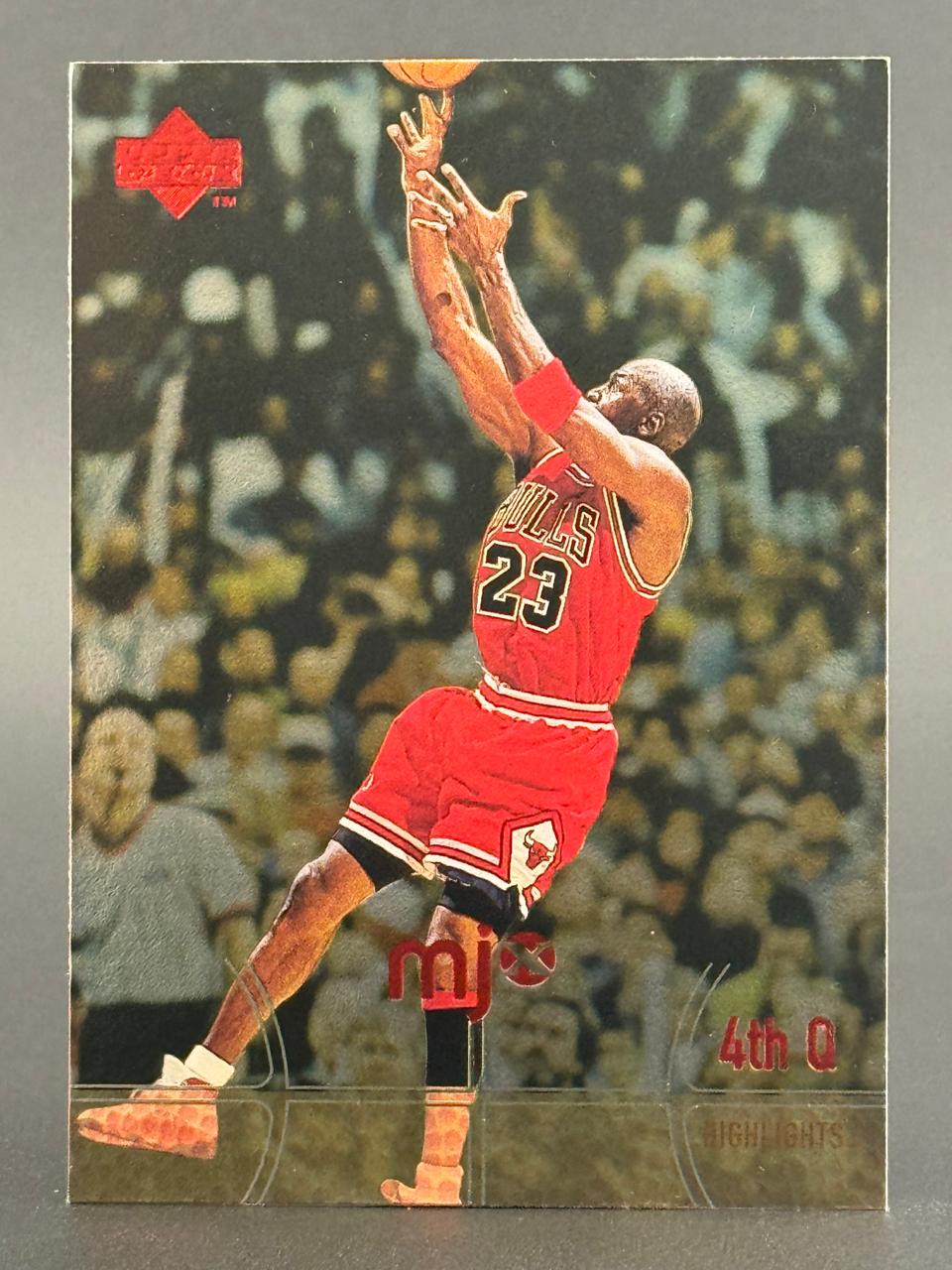 Michael Jordan trading card showing him shooting, with "4th Q" and "Highlights" text.