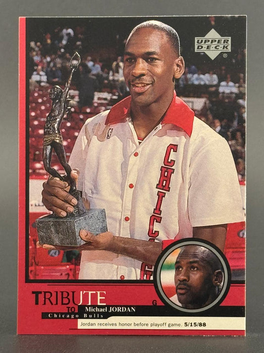 1988-89 Upper Deck Michael Jordan basketball card holding a trophy, featuring text "Tribute to Michael Jordan".