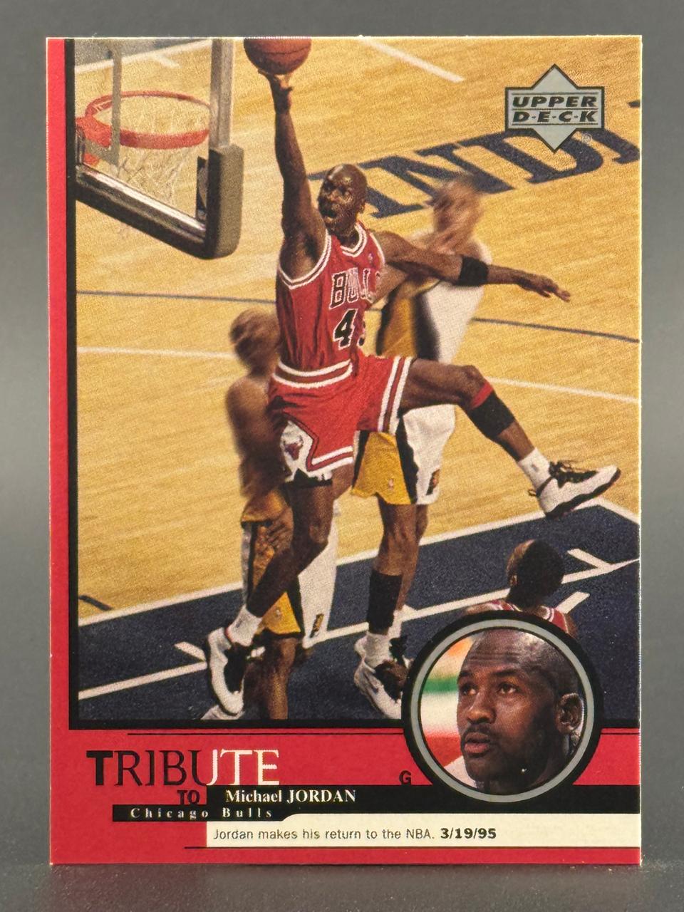 Michael Jordan Upper Deck Tribute to Chicago Bulls card with inset portrait and dunk action photo.