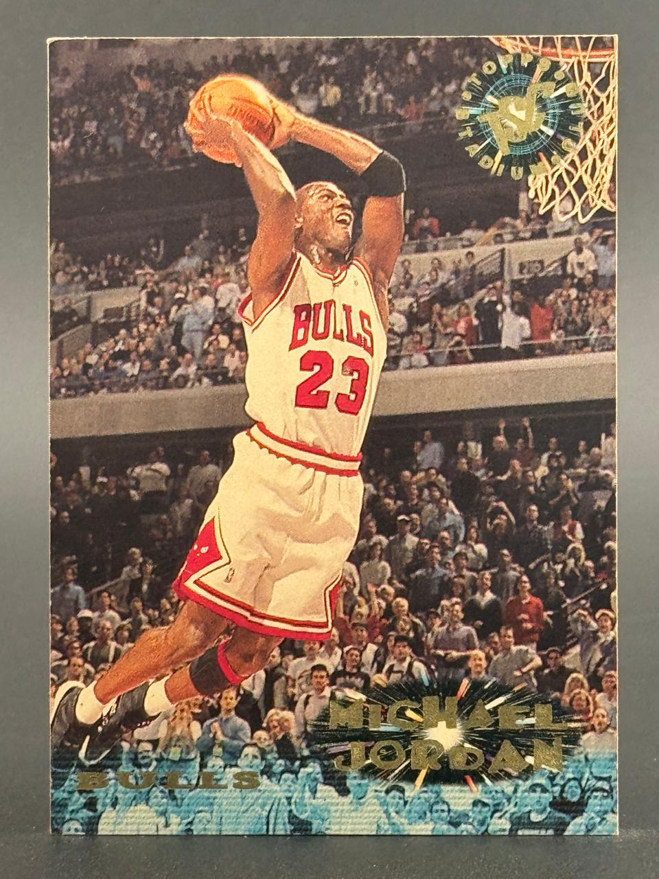 Michael Jordan 1992 Topps Stadium Club trading card showing him dunking a basketball.