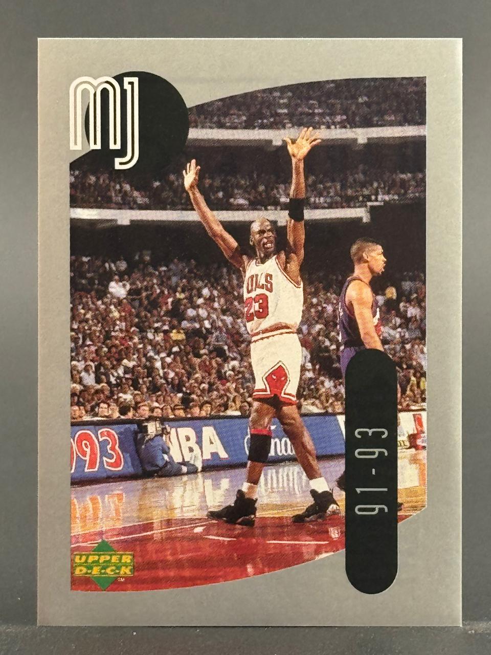 1991-93 Upper Deck Michael Jordan trading card, showing Jordan celebrating on the court with arms raised.