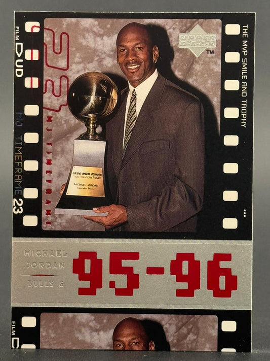 1996 Upper Deck Michael Jordan trading card holding an MVP trophy.