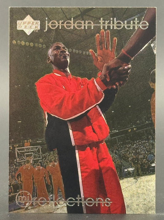 Michael Jordan Upper Deck Jordan Tribute trading card, showing him in a red-and-black warm-up suit.