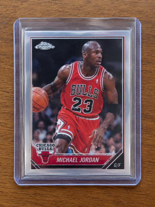 Michael Jordan Topps Chrome basketball card, showing him dribbling in a red Bulls uniform.