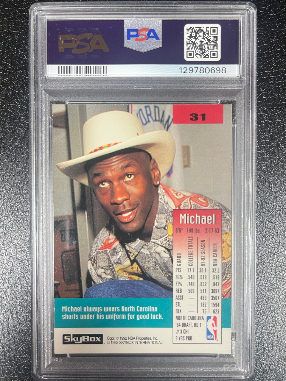 1992 SkyBox Michael Jordan #31 card showing him in a cowboy hat, graded PSA.